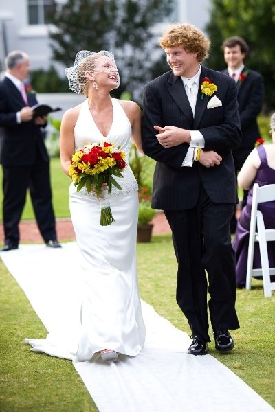 Us walking down the isle as Husband & Wife. Photography by Once Like a Spark.